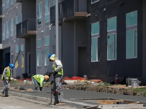 A construction crew works on a 290-unit transit-oriented, mixed-use affordable housing community in Fremont on April 22, 2020.