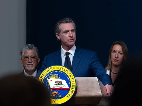 Gov. Gavin Newsom holds a press conference at a Home Depot in San Jose to sign bills that aim to curb retail theft and address voter concerns about California crime rates on Aug. 16, 2024.