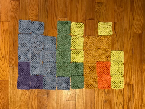 Crochet granny squares representing January through August average temperatures in Sacramento, produced as part of CapRadio's temperature blanket.