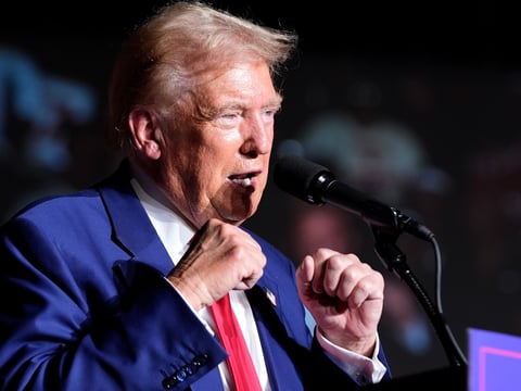 Republican presidential nominee former President Donald Trump gestures with his fists as he speaks during a campaign event at the World Market Center, Friday, Sept.13, 2024, in Las Vegas.