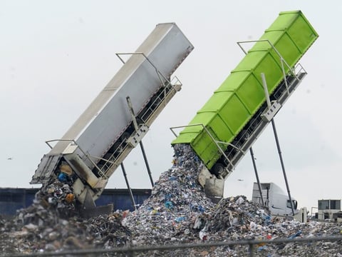 Garbage is unloaded into the Pine Tree Acres Landfill in Lenox Township, Mich., on July 28, 2022. State bans on commercial food waste have been largely ineffective, researchers found.