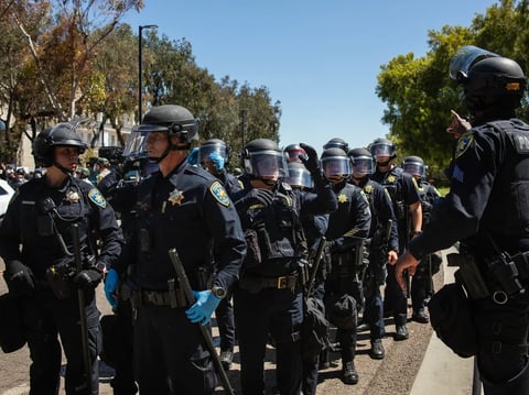 University of California campus police officers line up at a pro-Palestinian protest at UC San Diego in San Diego on May 6, 2024.