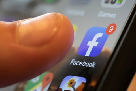 An iPhone displays the Facebook app in New Orleans, Aug. 11, 2019.
