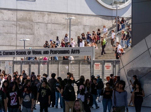 Students leave for the day the Ramon C. Cortines School of Visual and Performing Arts High School in downtown Los Angeles on Tuesday, Aug. 13, 2024.