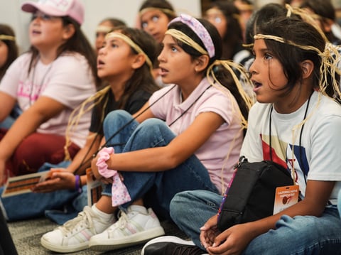Some of the 300 fourth-grade students and teachers from Inland Empire schools learn a traditional Native American song in a pre-celebration of the anticipated passage of Assembly Bill 1821 in San Bernardino, Calif., on Monday, Sept. 23, 2024.