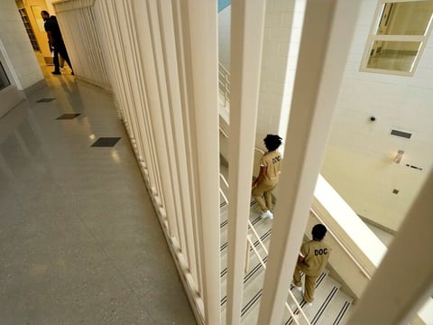 Inmates at the Cook County, Ill., jail head to a staging area at the jail's Division 11 law library before registering and voting in the local election in 2023 in Chicago.