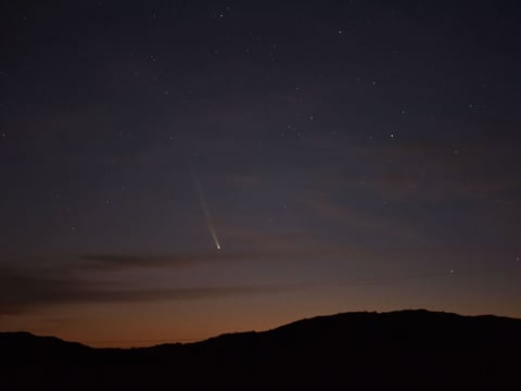 Comet C/2023 A3 Tsuchinshan-Atlas is seen over the hills near the village of Aguas Blancas, Lavalleja Department, Uruguay, at dawn on Sept. 28.
