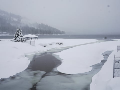 Snow covers the shore on Donner Lake, Saturday, March 2, 2024, in Truckee, Calif.