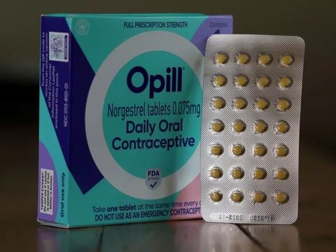 In this photo illustration, a package of Opill is displayed on March 22.