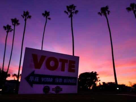 A sign directs the way to a polling place at Marina Park Community Center on Tuesday, Nov. 5, 2024, in Newport Beach, Calif.