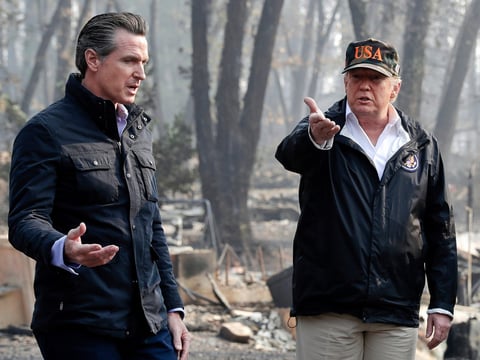 President Donald Trump talks with then California Gov.-elect Gavin Newsom, left, during a visit to a neighborhood impacted by the wildfires in Paradise, Calif., Nov. 17, 2018.