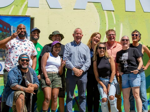 Sacramento Mayor Darrell Steinberg (center) poses with artists and Mutual Housing California and CADA, organizers who worked to put on the Graffiti Jam event on Labor Day.