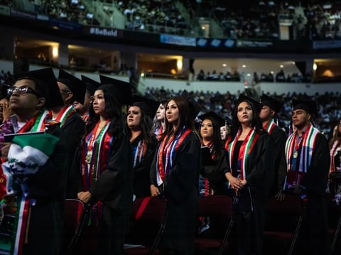 Graduating students take their seats at the Fresno State Chicano/Latino Commencement Celebration in the Save Mart Center in Fresno on May 18, 2024.