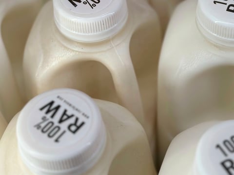 Bottles of raw milk are displayed for sale at a store in Temecula, Calif., on Wednesday, May 8, 2024.