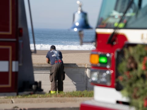 A firefighter patrols Ocean Beach in San Francisco during a tsunami warning on Thursday, Dec. 5, 2024.