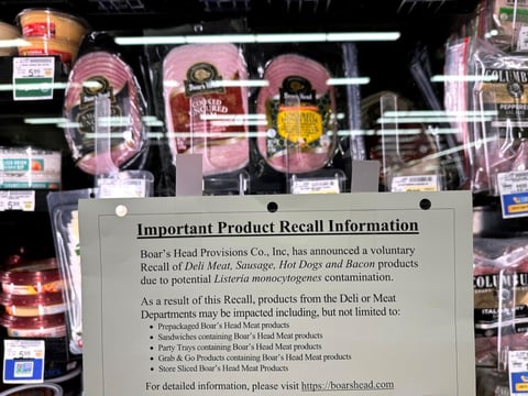 A recall notice citing listeria contamination risks is posted next to Boar's Head meats in a Safeway store in San Rafael, Calif., in July, as the deli meat company expanded its recall of ready-to-eat meat and poultry products.