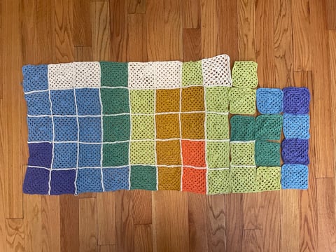 Crochet granny squares representing January through November average temperatures in Sacramento, produced as part of CapRadio's temperature blanket.