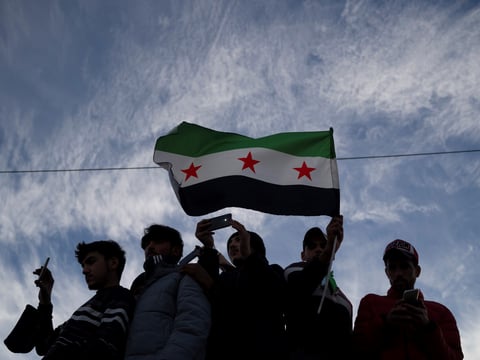 Syrians gather in celebration days after the fall of Bashar Assad's government at Umayyad Square in Damascus, Thursday, Dec. 12, 2024.