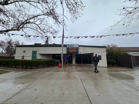 Law enforcement walks through Bret Harte Elementary School after a stabbing took place on Monday, Dec. 16, 2024.