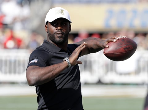 Former NFL quarterback Michael Vick throws the football before the NFL Pro Bowl football game, Sunday, Jan. 26, 2020, in Orlando, Fla.