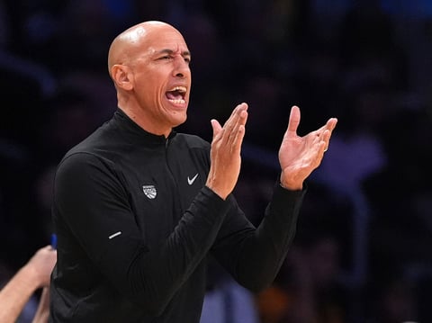 Sacramento Kings interim head coach Doug Christie claps during the first half of an NBA basketball game against the Los Angeles Lakers, Saturday, Dec. 28, 2024, in Los Angeles.