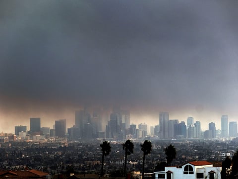 Thick heavy smoke from wildfires shrouds downtown Los Angeles on Wednesday, Jan. 8, 2025.