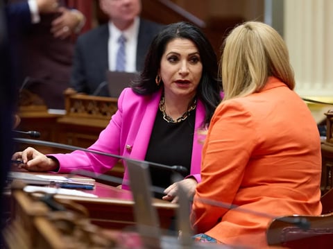 State Senators Susan Rubio, left, and Angelique Ashby, right, talk during the first Senate floor session of the year this week. Rubio is thought to be linked to a sprawling corruption probe from her time as a Baldwin Park City Council member.