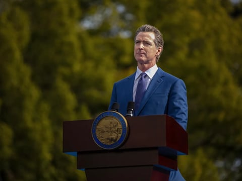 Gov. Gavin Newsom addresses attendees during his inauguration for a second term at the Plaza de California in Sacramento on Jan. 6, 2023.
