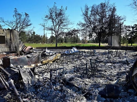 Charred chairs remain amid the ash and rubble from buildings burnt at the Altadena Golf Course during the Eaton Fire, on Jan. 23, 2025 in Altadena, Calif.