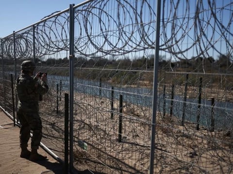 A U.S. Army soldier monitors the border with Mexico in Eagle Pass, Texas, last week. President Trump ordered 1,500 more active military personnel to the southern border, part of a broad immigration crackdown during his first week in office.