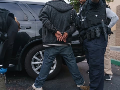 U.S. Immigration and Customs Enforcement agents arrest an immigrant considered a threat to public safety and national security during an early morning raid in Compton on June 6, 2022.