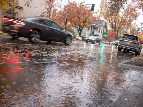 Cars drive by during a rain storm Friday, Nov. 22, 2024, in Sacramento.