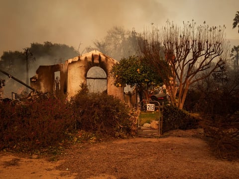 The remains of a smoldering home in an Altadena neighborhood affected by the Eaton Fire on Jan. 8, 2025.