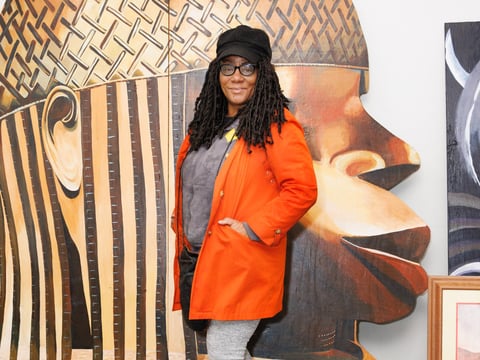 Sojourner Truth African Heritage Museum Founder Shonna McDaniels in front of a museum art display. The SOJO Museum in Sacramento is known for its extensive collection of historical Black art.