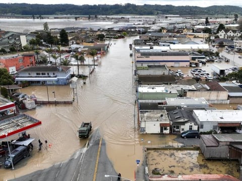 Flood waters cover most of Pajaro in Monterey County on March 12, 2023, after an atmospheric river storm caused a levee breach along the Pajaro River.