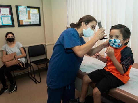 House Republicans this week passed a budget proposal that sets up cuts to Medicaid, the program that provides health insurance to lower-income households. Here a doctor examines a child at Southern Orange County Pediatric Associates on July 28, 2020.