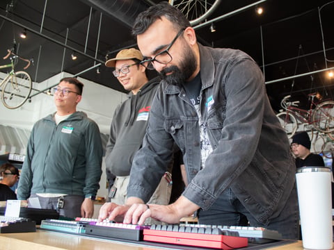 Event organizer Alec Valdez-Singh tests one of several keyboards on display Saturday, Feb. 22, 2025, at Bike Dog Brewing Company at 915 Broadway STE 200 in Sacramento.