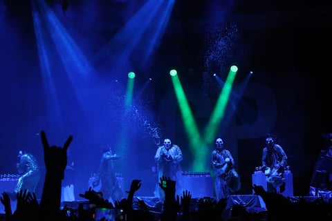 Insane Clown Posse sprays Faygo, a type of soda, into the crowd during their performance at Aftershock on Oct. 10, 2024.