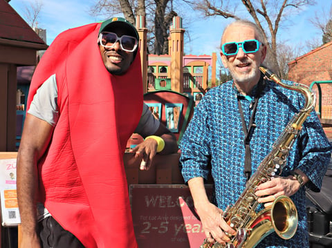 (L-R) Jerry Turner, also known as Jahri’s World, stands beside Dr. Paul D’ Blue who plays the saxophone after a live show at McKinley Park in Sacramento on Thursday, Feb. 20, 2025.