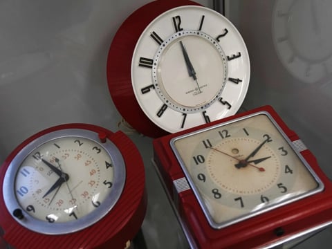 A selection of vintage clocks are displayed at the Electric Time Company March 9, 2023, in Medfield, Mass.