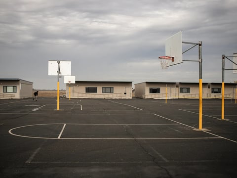 The basketball courts and row of trailers were classes are taught at Barbara Spratling Middle School in Keyes on Nov. 15, 2023.
