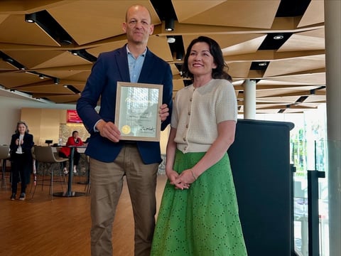 Insight Host Vicki Gonzalez receives "Distinguished Woman of the Year" award from Mayor Kevin McCarty. She was nominated for her work as a local journalist and for sharing her personal battle with cancer with her listeners.