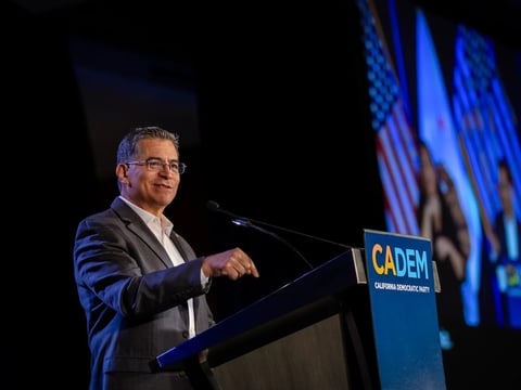 U.S. Secretary of Health and Human Services Xavier Becerra speaks at the California Democratic Party delegation breakfast in Chicago, on Aug. 21, 2024. Becerra announced Wednesday he is running for California governor.