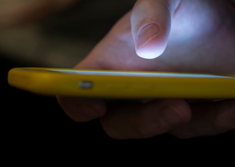 In this Aug. 11, 2019, file photo, a man uses a cell phone in New Orleans.