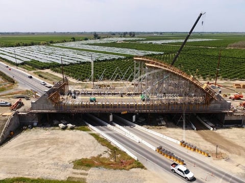 The Tied Arch Bridge construction site, which will take high-speed trains over State Route 43, is shown in an aerial view Tuesday, April 15, 2025, in Fresno County, Calif.