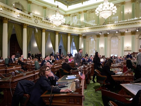 Assemblymembers watch the results of a vote during an Assembly floor session at the state Capitol in Sacramento on March 13, 2025.