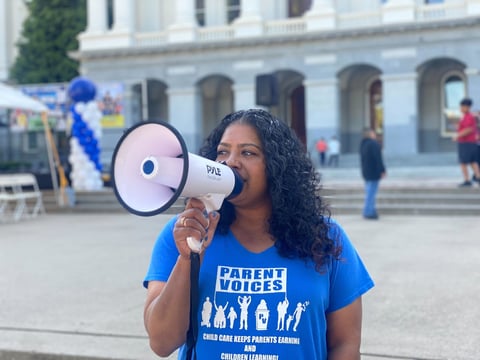 Mary Ignatius with the advocacy group Parent Voices poses in front of the State Capitol. May 14, 2025