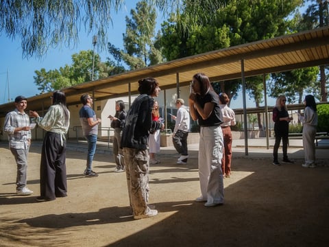 Students participate in an interactive conversational exercise during one of Professor Rachel Cerdenio's non-credit English as a Second Language classes at Los Angeles Pierce College in Woodland Hills on May 8, 2025.