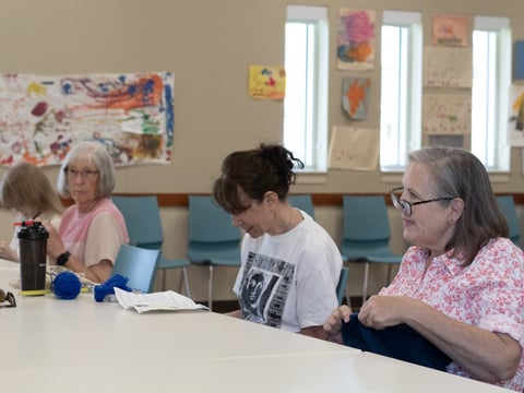 Lorraine Carter Salazar works on a knitting project at a craft group she attends weekly at a Sacramento library branch.