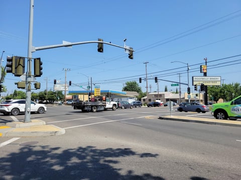 Cars drive by Thursday, June 5, 2025, at the intersection of Folsom Boulevard and 65th Street in Sacramento.